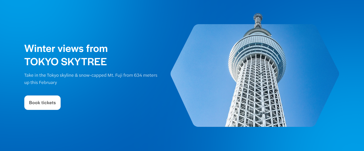 Tokyo Skytree tower under a clear blue sky.